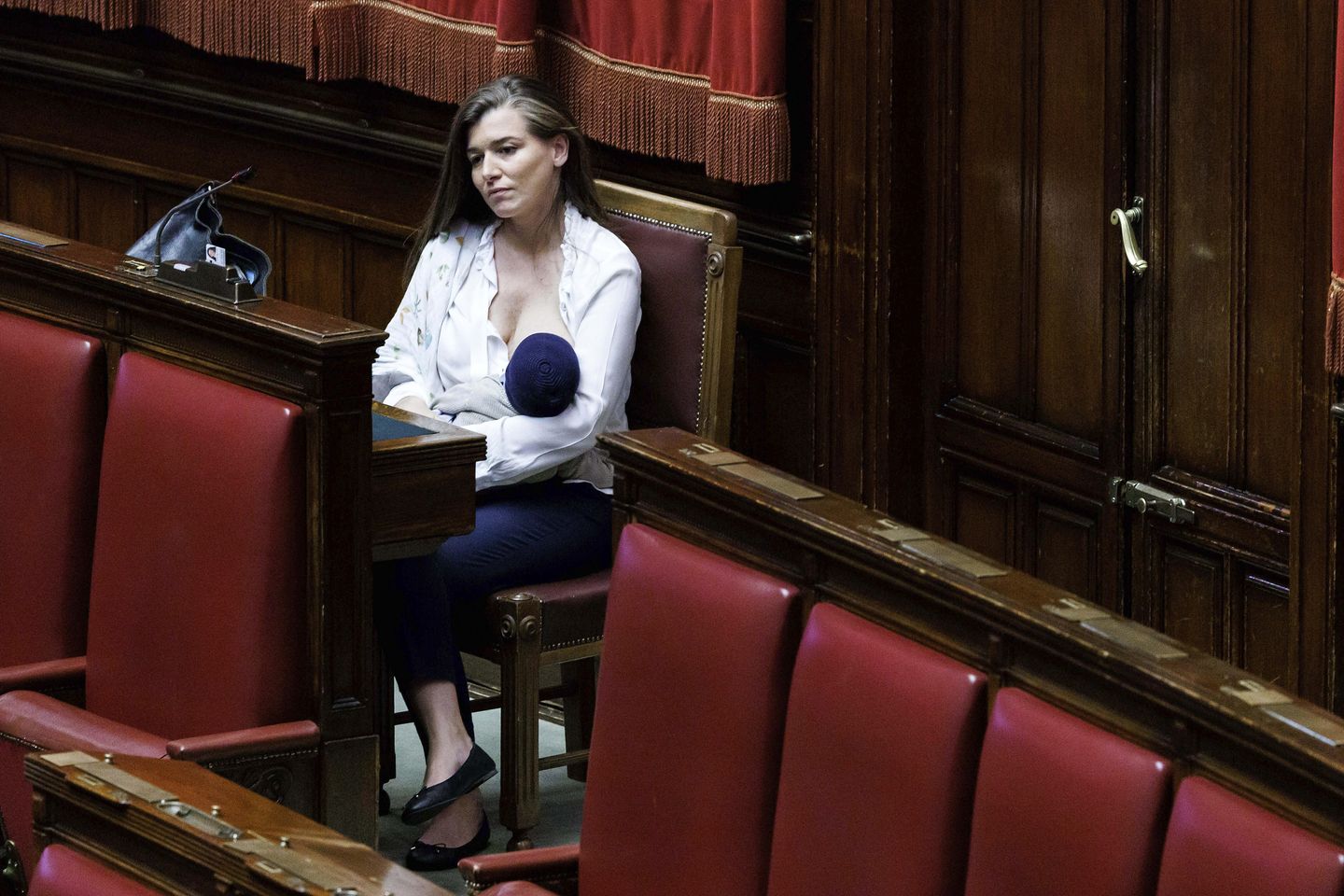 Italian lawmaker who fought to allow nursing one's baby during working session is now first to do so