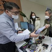 Peter Møller, second from right, attorney and co-founder of the Danish Korean Rights Group, submits the documents at the Truth and Reconciliation Commission in Seoul, South Korea, Nov. 15, 2022. South Korea’s Truth and Reconciliation Commission said Thursday, June 8, 2023, it will investigate 237 more cases of South Korean adoptees who suspect their family origins were manipulated to facilitate their adoptions in Europe and the United States. (AP Photo/Ahn Young-joon, File)