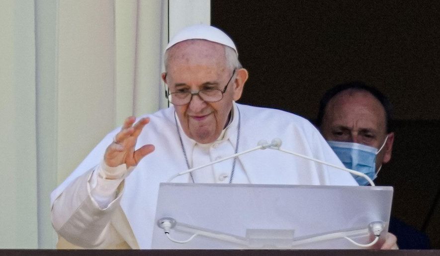 In this file photo dated Sunday, July 11, 2021, Pope Francis appears on a balcony of the Agostino Gemelli Polyclinic in Rome. Pope Francis went to the hospital Wednesday, June 7, 2023, to undergo abdominal surgery to treat an intestinal blockage, two years after he had his colon removed 33 centimeters (13 inches) because of inflammation and narrowing of the large intestine. (AP Photo/Alessandra Tarantino, File)