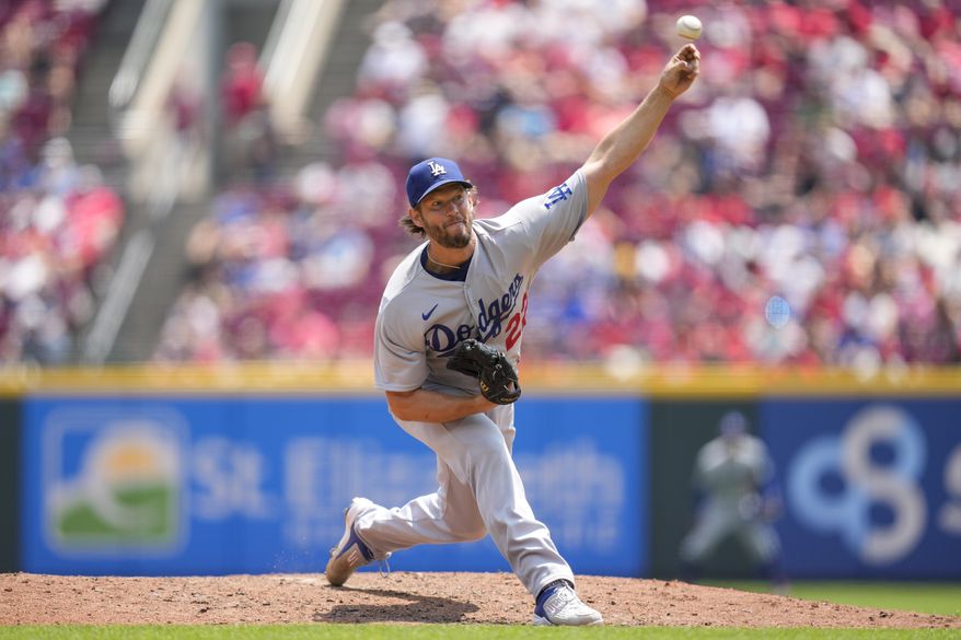 Los Angeles Dodgers starting pitcher Clayton Kershaw (22) throws against the Cincinnati Reds in the fifth inning of a baseball game in Cincinnati, Thursday, June 8, 2023. (AP Photo/Jeff Dean)