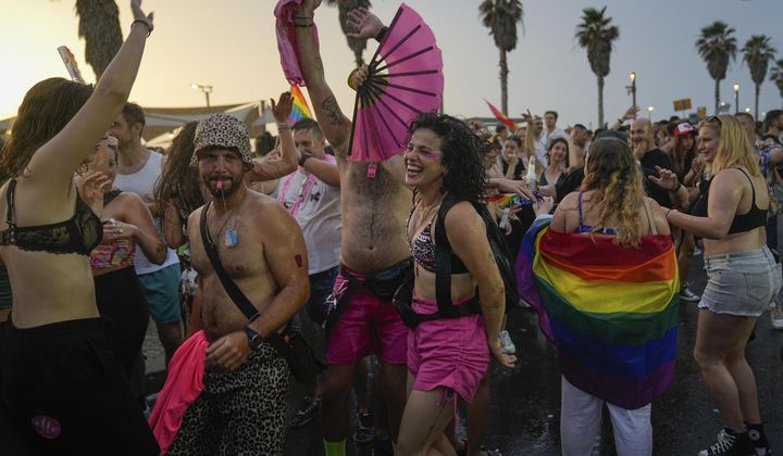 People dance during the annual Pride Parade in Tel Aviv, Israel, Thursday, June 8, 2023. (AP Photo/Ohad Zwigenberg)