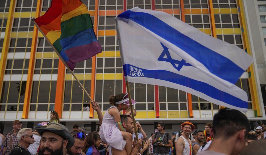 People participate in the annual Pride Parade in Tel Aviv, Israel, Thursday, June 8, 2023. (AP Photo/Ohad Zwigenberg)