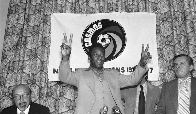 New York Cosmos&#x27; Pele gestures during a press conference in New York, Sept. 29, 1977. After two decades competing against Real Madrid, Manchester United and Brazil, Lionel Messi will be going against the NFL, Major League Baseball and the NBA.(AP Photo/Ira Schwarz, File)