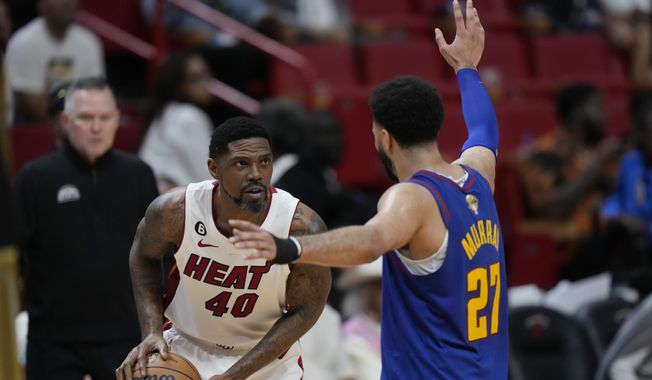Denver Nuggets guard Jamal Murray (27) defends Miami Heat forward Udonis Haslem (40) during the second half of Game 3 of the NBA Finals basketball game, Wednesday, June 7, 2023, in Miami. (AP Photo/Wilfredo Lee)
