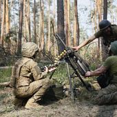 Ukrainian soldiers fire the grenade launcher towards the Russian positions on the frontline near Kreminna, Luhansk region, Ukraine, Thursday, June 8, 2023. (Roman Chop via AP)
