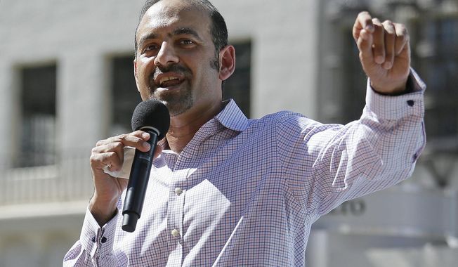 FILE - Dilawar Syed, president of the software company Freshdesk, speaks during a Tech Stands Up rally outside City Hall in Palo Alto, Calif., March 14, 2017. The Senate has confirmed the highest-ranking Muslim official in the U.S. government. Dilawar Syed was confirmed Thursday, June 8, 2023, as deputy administrator of the Small Business Administration in a 52-42 vote. (AP Photo/Eric Risberg, File)