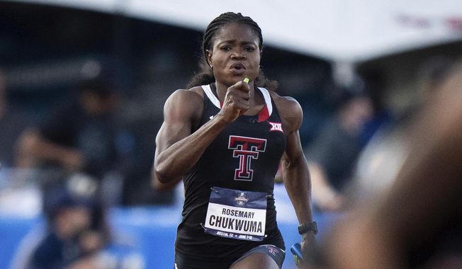 Texas Tech&#x27;s Rosemary Chukwuma runs the second leg in the 400-meter relay semifinals at the NCAA outdoor track and field championships Thursday, June 8, 2023, in Austin, Texas. (Sara Diggins/Austin American-Statesman via AP)