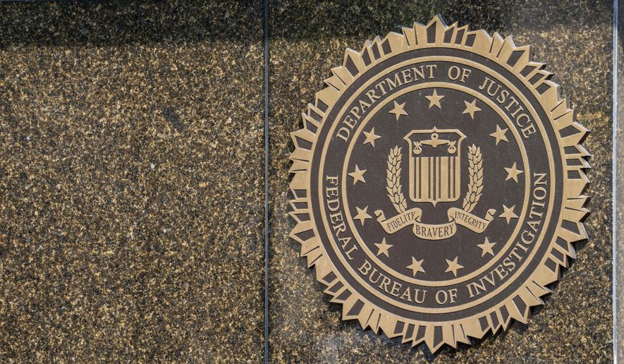 The seal on the J. Edgar Hoover FBI Building is seen Friday, June 9, 2023, in Washington. Former President Donald Trump has been indicted on charges of mishandling classified documents at his Florida estate. The remarkable development makes him the first former president in U.S. history to face criminal charges by the federal government that he once oversaw. (AP Photo/Alex Brandon)