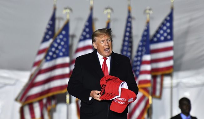 Former President Donald Trump enters the stage during a rally for Georgia Republican candidates in Commerce, Ga., on March 26, 2022. Trump is scheduled to appear Saturday, June 10, 2023, at the Georgia Republican Party&#x27;s annual convention in Columbus, Ga., two days after he announced he had been indicted for mishandling classified documents. (Hyosub Shin/Atlanta Journal-Constitution via AP, File)