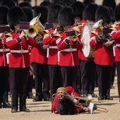 A trombone player of the military band faints during the Colonel&#x27;s Review, the final rehearsal of the Trooping the Colour, the King&#x27;s annual birthday parade, at Horse Guards Parade in London, Saturday, June 10, 2023. (AP Photo/Alberto Pezzali)