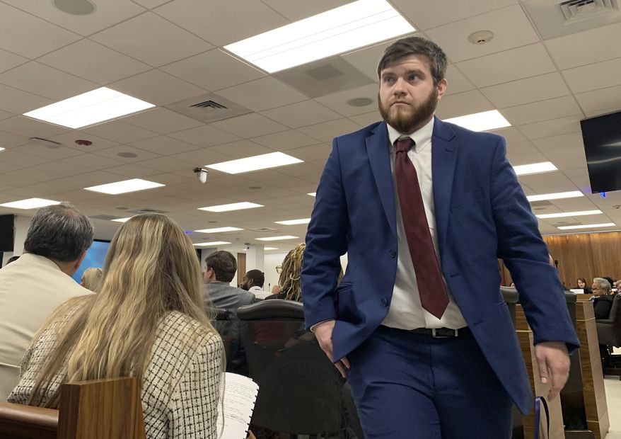 Kyle Warren-Love, a transgender man from Prospect Hill, returns to his seat in the state Senate Education Committee after speaking against a bill banning transgender athletes from playing on sports teams that align with their gender identity, Wednesday, June 14, 2023, in Raleigh, N.C. (AP Photo/Hannah Schoenbaum)