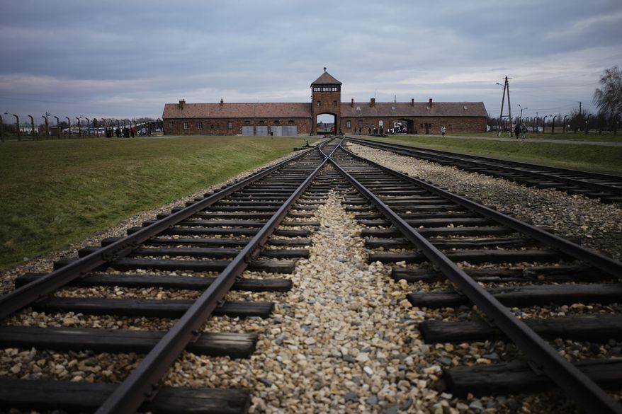 The railway tracks where hundred thousands of people arrived to be directed to the gas chambers inside the former Nazi death camp of Auschwitz Birkenau, or Auschwitz II, are pictured in Oswiecim, Poland, Saturday, Dec. 7, 2019. The organization that handles claims on behalf of Jews who suffered under the Nazis says that Germany has agreed extend compensation for Holocaust survivors around the globe for the coming year. (AP Photo/Markus Schreiber, file)