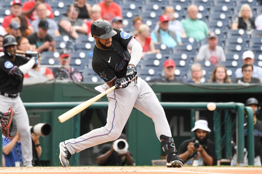 Miami Marlins left fielder Bryan De La Cruz (14) taking a swing during the first inning of an MLB game against the Washington Nationals at Nationals Park in Washington D.C., June 16, 2023. (Photo by Billy Sabatini/All-Pro Reels)