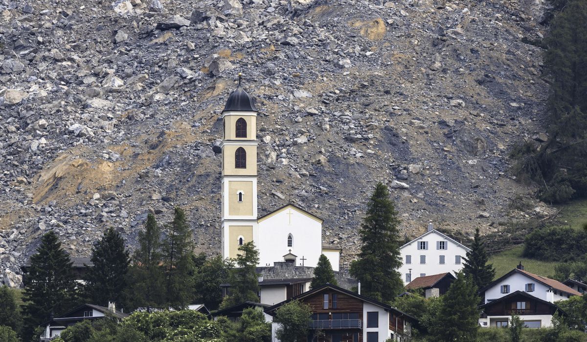 NextImg:Mass of rock slides down Swiss mountainside above evacuated village, narrowly missing settlement
