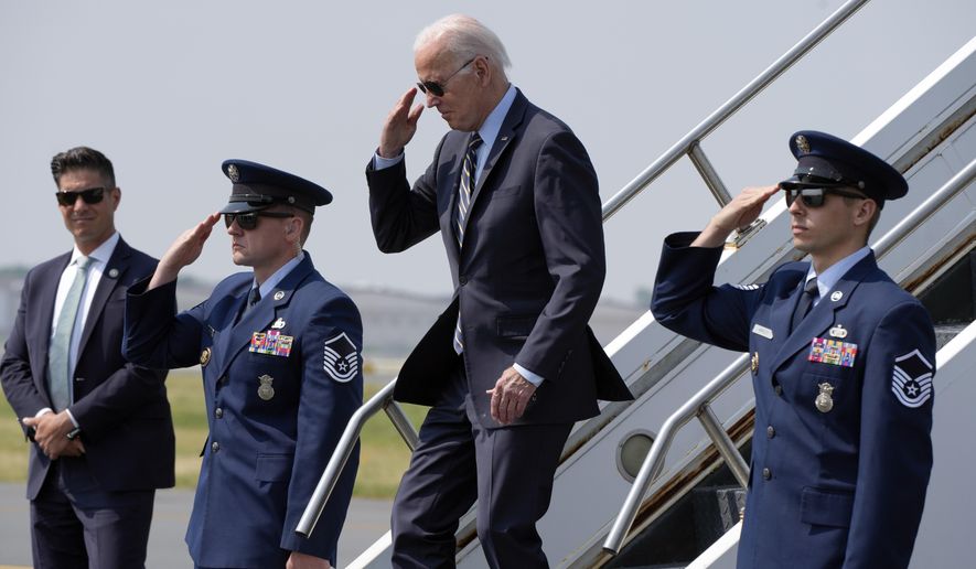President Joe Biden returns a salute as he walks down the steps of Air Force One at Philadelphia International Airport in Philadelphia, Saturday, June 17, 2023. (AP Photo/Manuel Balce Ceneta)