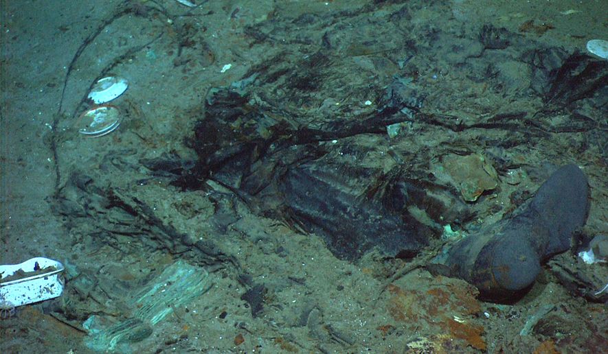 This 2004 photo provided by the Institute for Exploration, Center for Archaeological Oceanography/University of Rhode Island/NOAA Office of Ocean Exploration, shows the remains of a coat and boots in the mud on the sea bed near the Titanic's stern. (Institute for Exploration, Center for Archaeological Oceanography/University of Rhode Island/NOAA Office of Ocean Exploration) **FILE**
