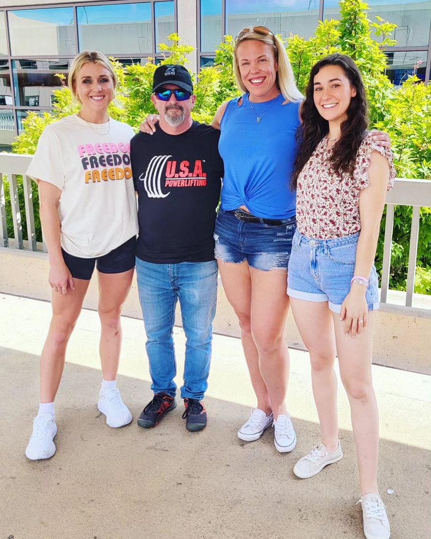 USA Powerlifting President Larry Maile poses with NCAA All-American swimmer Riley Gaines, Team Canada powerlifter April Hutchinson, and skateboarding champion Taylor Silverman. Photo courtesy Independent Council on Women's Sports.