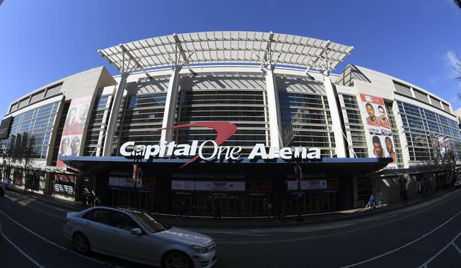 An exterior view of Capital One Arena is seen Saturday, March 16, 2019, in Washington. Capital One Arena is home to the Washington Capitals NHL hockey team and Washington Wizards NBA basketball team. A person with knowledge of the sale tells The Associated Press the Qatar Investment Authority is buying a 5% stake of the parent company of the NBA&#x27;s Washington Wizards and NHL&#x27;s Washington Capitals for $4.05 billion. It is believed to be the first time the government of Qatar is investing in North American professional sports. (AP Photo/Nick Wass) **FILE**