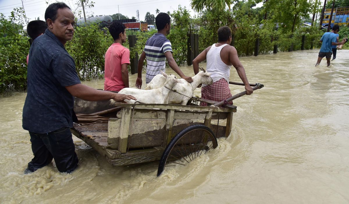 NextImg:Flooding displaces tens of thousands and kills 1 as heavy monsoon rains batter Indian villages