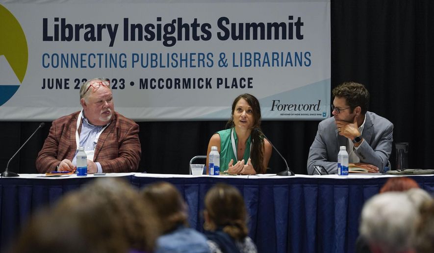 Heather Hutto, executive director of Bristow Public Library, center, along with former President of United for Libraries Skip Dye, left, and Executive Director of the Digital Public Library of America John Bracken, right, speaks during a panel discussion about understanding and combating book bans at the American Library Association's annual conference and exhibition on Friday, June 23, 2023, at McCormick Place in Chicago. (AP Photo/Erin Hooley)