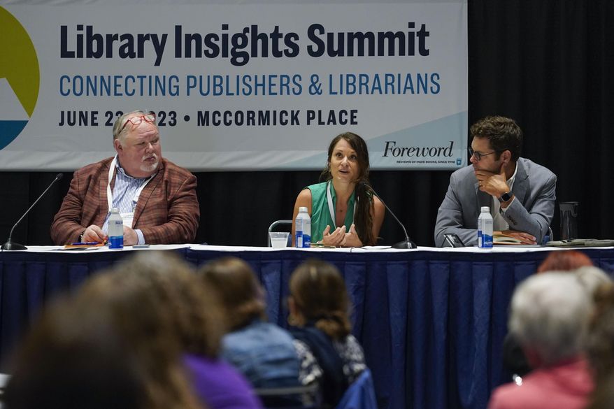 Heather Hutto, executive director of Bristow Public Library, center, along with former President of United for Libraries Skip Dye, left, and Executive Director of the Digital Public Library of America John Bracken, right, speaks during a panel discussion about understanding and combating book bans at the American Library Association's annual conference and exhibition on Friday, June 23, 2023, at McCormick Place in Chicago. (AP Photo/Erin Hooley)