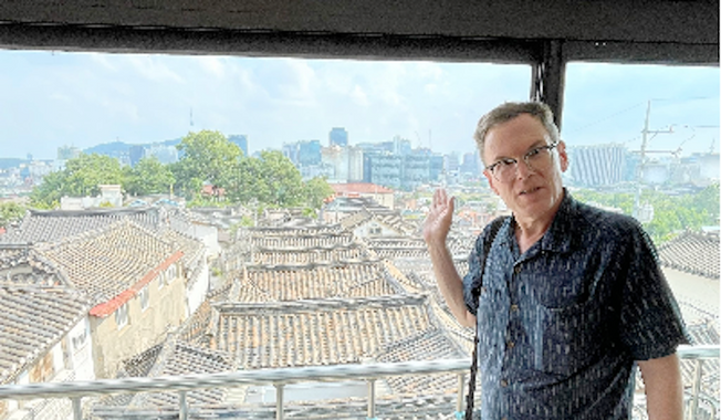 Robert Fouser, a Rhode Island author and academic who also lives in Japan and South Korea, is spearheading an effort to preserve the Asian architectural heritage of traditional homes, called &quot;hanok,&quot; in Seoul. (Photo by Andrew Salmon / The Washington Times)