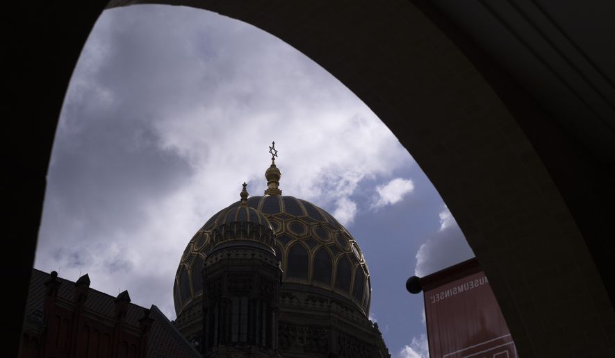 Clouds cover the sky over the Star of David on top of the &quot;New Synagogue&quot; in central Berlin, Germany, Tuesday, June 27, 2023. The annual antisemitism report with figures from 2022 of the Department for Research and Information on Anti-Semitism, or RIAS, is presented in the German capital Berlin. (AP Photo/Markus Schreiber)
