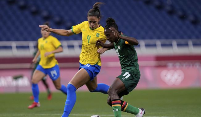 Brazil&#x27;s Rafaelle, left, and Zambia&#x27;s Babra Banda battle for the ball during a women&#x27;s soccer match at the 2020 Summer Olympics, Tuesday, July 27, 2021, in Saitama, Japan. (AP Photo/Martin Mejia)