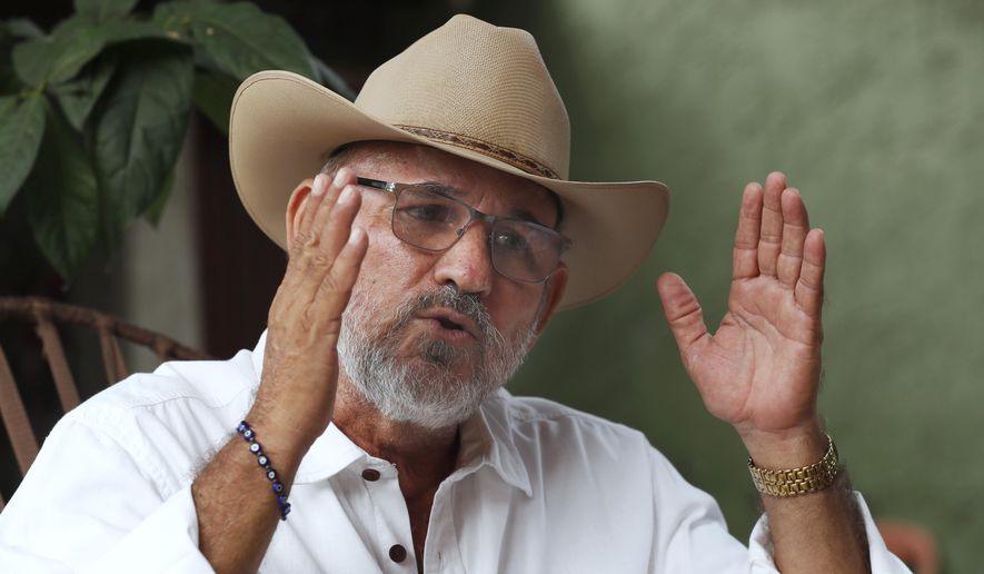 FILE - Hipolito Mora, founder of the state's civilian armed self-defense movement, speaks during an interview at his home in Ruana, Michoacan state, Mexico, Oct. 3, 2019. Mora has been killed on Thursday, June 29, 2023, in a successful attempt on his life. (AP Photo/Marco Ugarte, File)