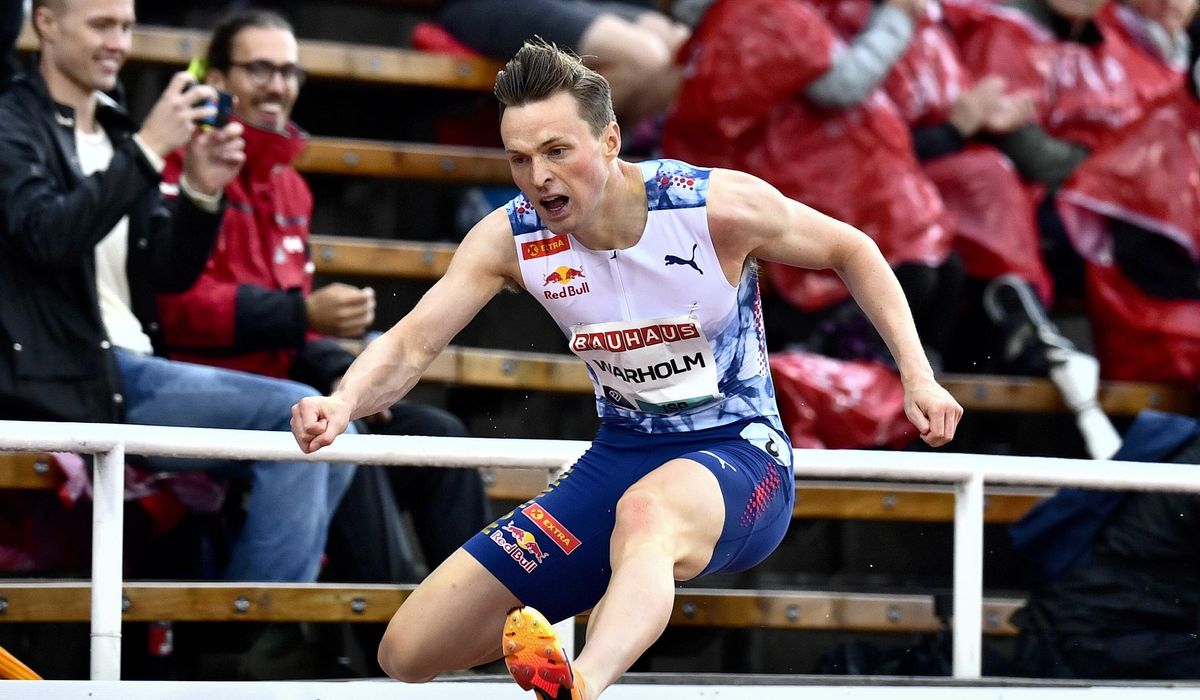 NextImg:Olympic champion Warholm boos protesters on track who disrupted his 400-meter hurdles race