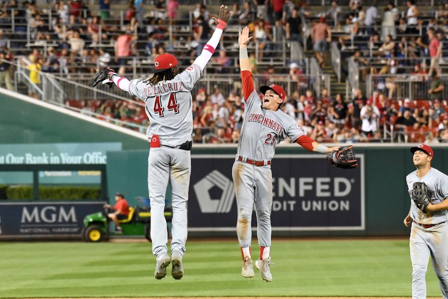 Cincinnati Reds third baseman Elly De La Cruz (44) and centerfielder TJ Friedl (29) high five each other after the Reds 3-2 win over the Washington Nationals at Nationals Park in Washington D.C., July 3, 2023. (Photo by Billy Sabatini/All-Pro Reels)