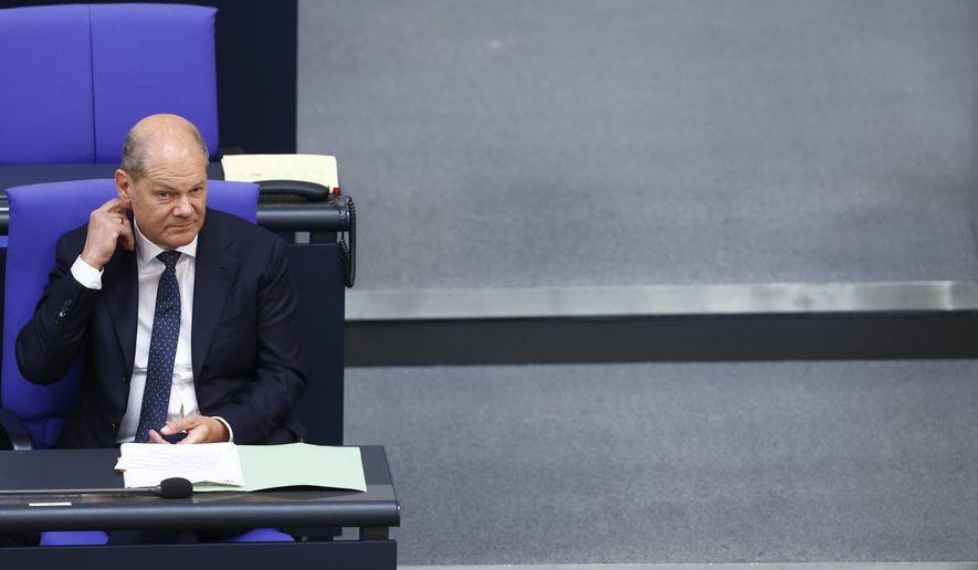 German Chancellor Olaf Scholz attends a meeting of the German federal parliament, Bundestag, at the Reichstag building in Berlin, Germany, Wednesday, July 5, 2023. (AP Photo/Michele Tantussi)