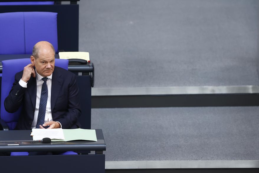 German Chancellor Olaf Scholz attends a meeting of the German federal parliament, Bundestag, at the Reichstag building in Berlin, Germany, Wednesday, July 5, 2023. (AP Photo/Michele Tantussi)