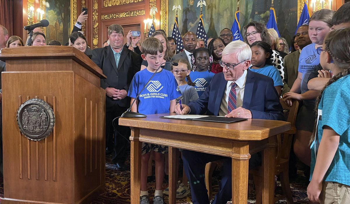 NextImg:Average income taxes in Wisconsin to go down $3 a month under cut signed by Evers