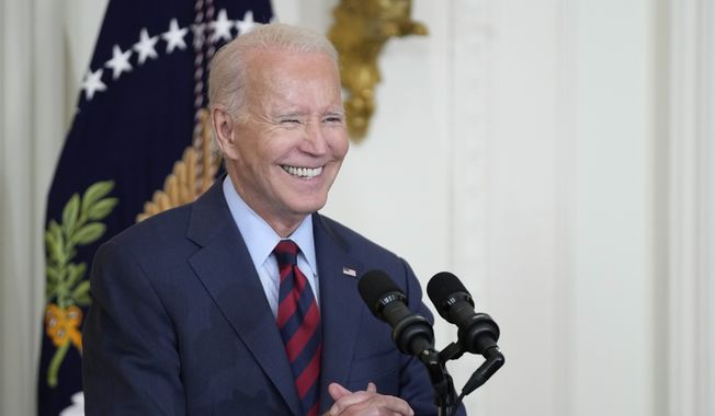 President Joe Biden smiles as he speaks about lowering health care costs, Friday, July 7, 2023, in the East Room of the White House in Washington. (AP Photo/Patrick Semansky)