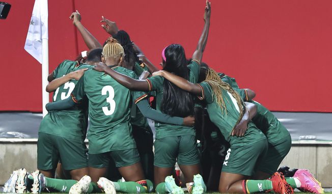Zambian players celebrate after scoring their side&#x27;s second goal during the women&#x27;s international soccer match between Germany and Zambia at Sportpark Ronhof Thomas Sommer in Furth, Germany, Friday July 7, 2023. (Daniel Karmann/dpa via AP)