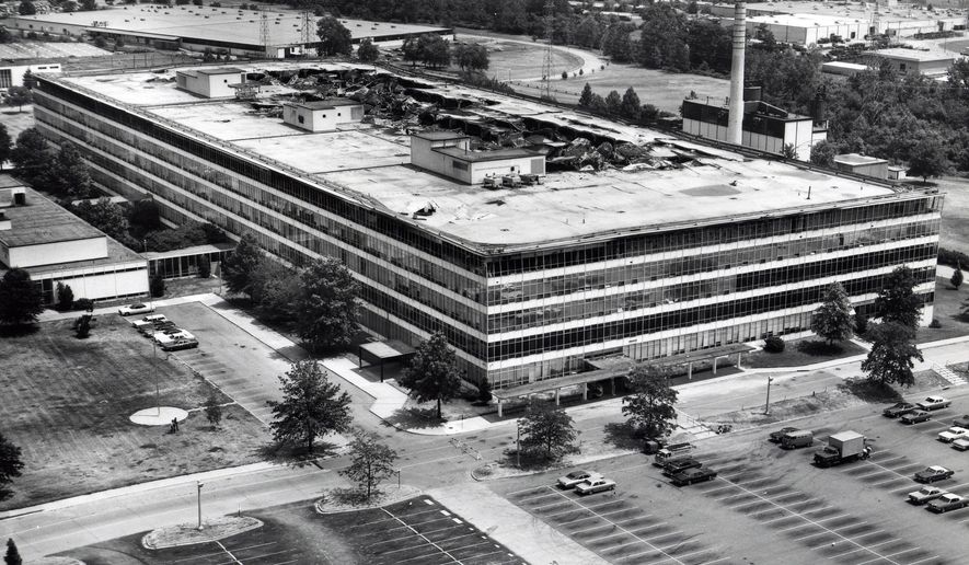 This photo provided by the National archives shows the damaged sixth floor and roof of the Military Personnel Records Center in Overland, Mo., near St. Louis, after a massive fire that started on July 12, 1973. (National Archives via AP)