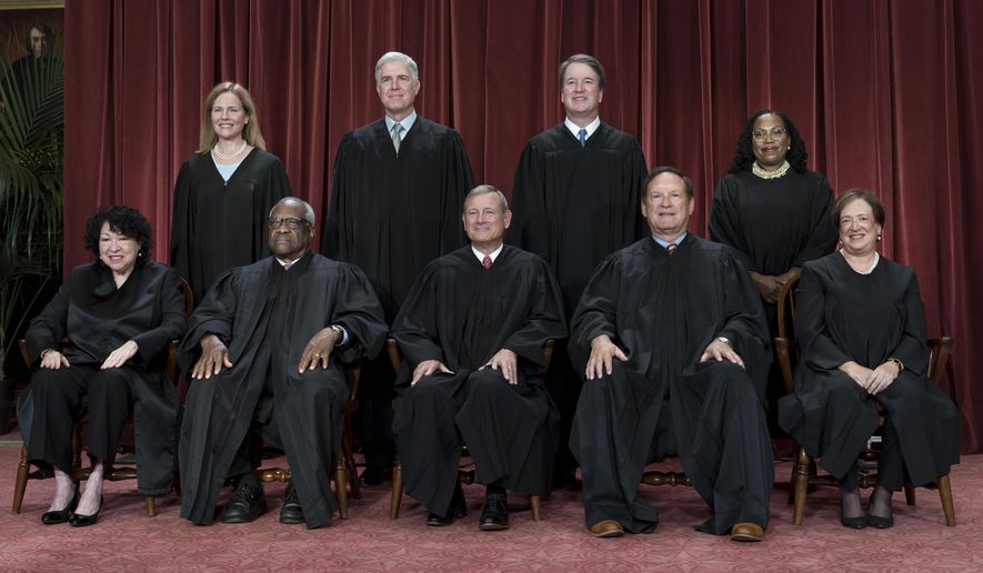 Members of the Supreme Court sit for a new group portrait following the addition of Associate Justice Ketanji Brown Jackson, at the Supreme Court building in Washington, Oct. 7, 2022. Bottom row, from left, Justice Sonia Sotomayor, Justice Clarence Thomas, Chief Justice John Roberts, Justice Samuel Alito, and Justice Elena Kagan. Top row, from left, Justice Amy Coney Barrett, Justice Neil Gorsuch, Justice Brett Kavanaugh, and Justice Ketanji Brown Jackson. (AP Photo/J. Scott Applewhite, File)