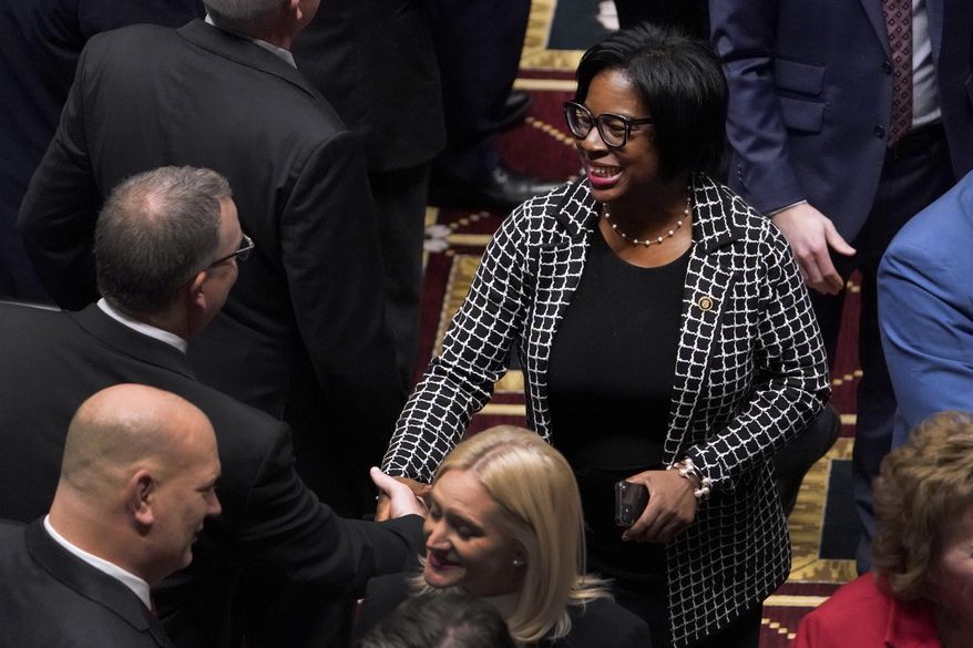 Missouri Sen. Karla May, D-St. Louis, shakes hands with a fellow lawmaker as she enters the House chamber to hear the State of the State address, Jan. 18, 2023, in Jefferson City, Mo. May is running for U.S. Senate in Missouri, she announced Tuesday, July 11, in her hometown. The St. Louis Democrat is vying for the Democratic nomination against St. Louis County Prosecuting Attorney Wesley Bell and Marine veteran Lucas Kunce. (AP Photo/Jeff Roberson, File)