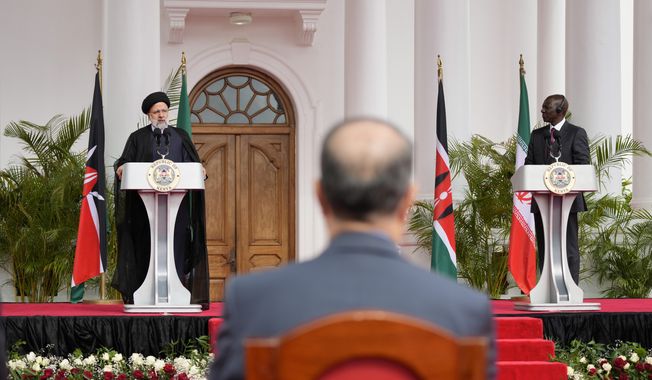 Iran&#x27;s President Ebrahim Raisi, left, and Kenya&#x27;s President William Ruto, right, give a joint press conference after meeting at State House in Nairobi, Kenya, Wednesday, July 12, 2023. Iran&#x27;s president has begun a rare visit to Africa as the country, which is under heavy U.S. economic sanctions, seeks to deepen partnerships around the world. (AP Photo/Khalil Senosi)