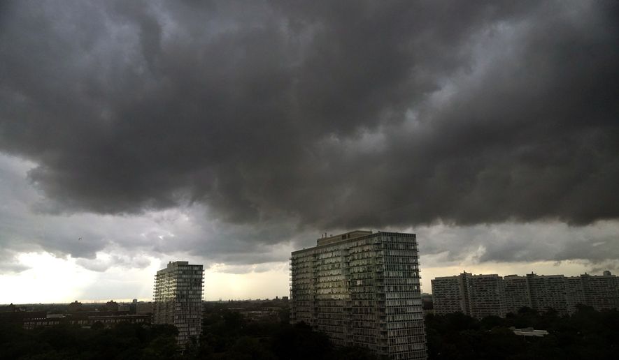 Storm clouds pass over the Bronzville neighborhood of Chicago heading East out over Lake Michigan as the National Weather Service continued to issue multiple tornado warnings in the greater metropolitan area Wednesday, July 12, 2023. (AP Photo/Charles Rex Arbogast)