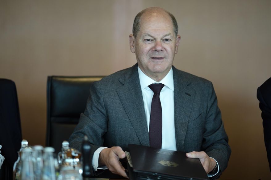 German Chancellor Olaf Scholz attends the Cabinet meeting of the German government at the chancellery in Berlin, Germany, Thursday, July 13, 2023. (AP Photo/Markus Schreiber)