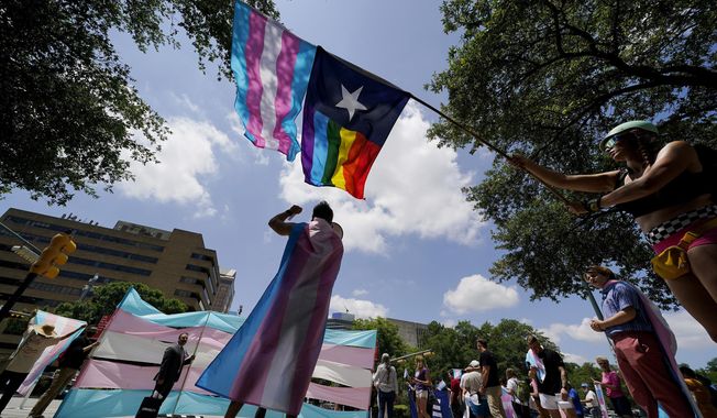 Demonstrators gather on the steps of the Texas Capitol to speak against transgender-related legislation bills being considered in the Texas Senate and Texas House in Austin, Texas, on May 20, 2021. (AP Photo/Eric Gay) **FILE**