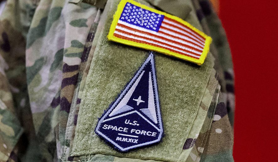A soldier wears a U.S. Space Force uniform during a ceremony for U.S. Air Force airmen transitioning to U.S. Space Force guardian designations at Travis Air Force Base, Calif., Feb. 12, 2021. The U.S. Air Force&#x27;s combat wings will be turned into “units of action” designed to better fight a war with China, under a major reorganization of the service and its new sub-service, the Space Force, announced by senior service leaders this week. (AP Photo/Noah Berger, File)