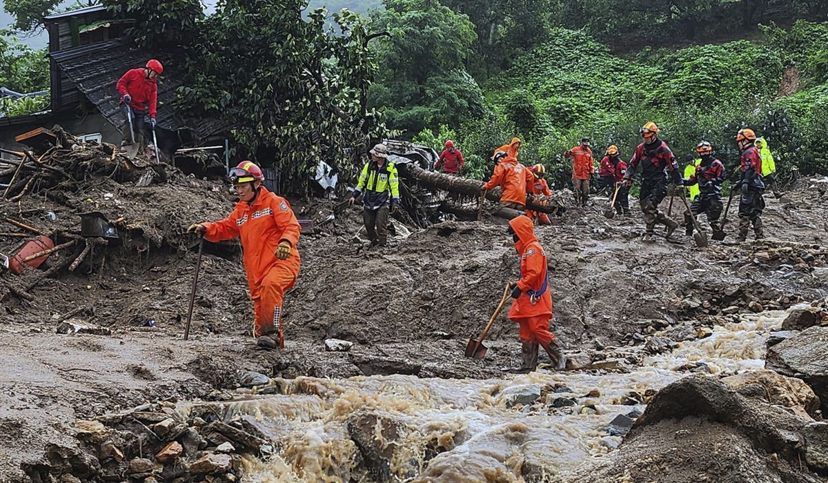 NextImg:Days of torrential rain in South Korea leave at least 22 dead in landslides and floods