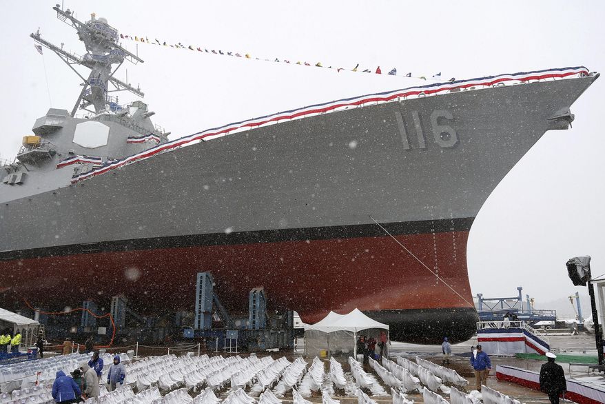 Snow falls on the future USS Thomas Hudner, a U.S. Navy destroyer named after Korean War veteran Thomas Hudner, during a christening ceremony at Bath Iron Works in Bath, Maine, April 1, 2017. The U.S. is sending additional fighter jets and a warship to the Strait of Hormuz and the Gulf of Oman to increase security in the wake of Iranian attempts to seize commercial ships there. The Pentagon said Monday that the USS Thomas Hudner, a destroyer, and a number of F-35 fighter jets will be heading to the area. The Hudner had been in the Red Sea. (AP Photo/Mary Schwalm, File)