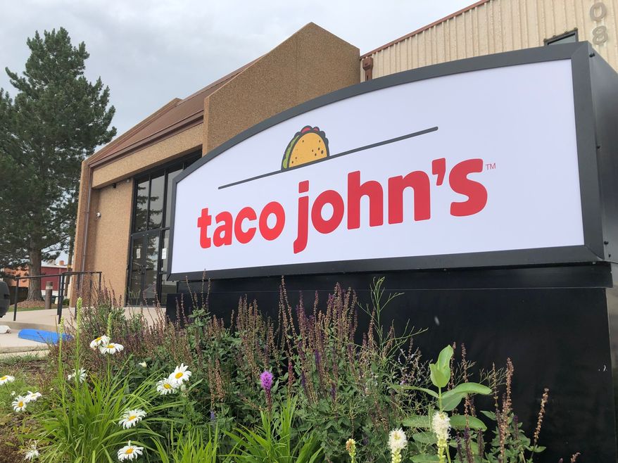 A sign stands outside the corporate headquarters of Cheyenne-based Taco John's, Aug. 1, 2019, in Cheyenne, Wyo. Taco Bell rang up a win Tuesday, July 18, 2023, in its quest to make “Taco Tuesday" free of trademark restrictions, with Taco John’s formally abandoning its decades-old claim to own the phrase amid a challenge from its bigger rival. (AP Photo/Mead Gruver, File)