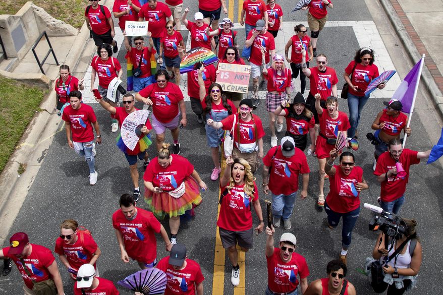 Hundreds of drag queens and allies march from Cascades Park to the Florida Capitol in Tallahassee, Fla., where a rally was held on the steps of the Historical Capitol building to speak out in opposition to "continued attacks on the LGBTQIA+ community by Gov. Ron DeSantis and other Republican state legislators," April 25, 2023. Librarians in Florida who feared fines for hosting drag queen story hours and Pride parade organizers who worried about citations for including drag performers can breathe easier now. That is because a federal judge in Florida ruled on Wednesday, July 19, 2023, that his injunction blocking the state’s anti-drag law extends to all Florida venues. (Alicia Devine/Tallahassee Democrat via AP) **FILE**
