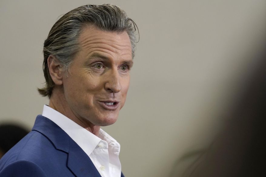 California Gov. Gavin Newsom speaks at a news conference in Sacramento, Calif., on March 16, 2023. Newsom had threatened to fine the Temecula Valley Unified School District for not approving a social studies curriculum for elementary school students. The board approved the curriculum in a special meeting on Friday, July 21. Board President Joseph Komrosky said the vote was not in response to Newsom's threat. He said it was to avoid a potential lawsuit. (AP Photo/Rich Pedroncelli, File)
