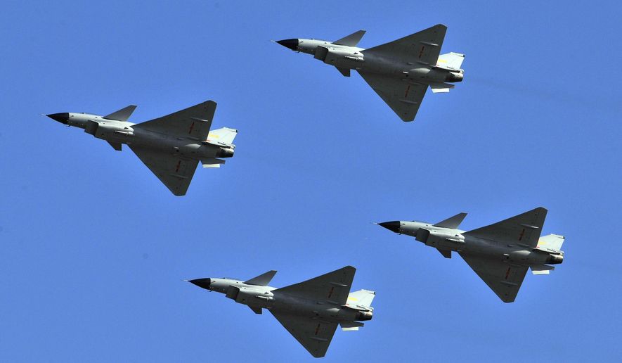 J-10 jet fighters perform in formation to celebrate the 60th anniversary of the People&#x27;s Liberation Army Air Force in Beijing, China, Nov. 15, 2009. China sent dozens of warplanes, including fighter jets and bombers, toward Taiwan, the island&#x27;s Defense Ministry said Saturday, July 22, 2023, marking a forceful display days before the democracy plans to hold military exercises aimed at defending itself against a possible invasion.(AP Photo/File)